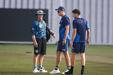 Afghanistan vs New Zealand 1st Test Day 1: Tim Southee, center, and Mitchell Santner, right, interact with Afghanistan's head coach, Jonathan Trott